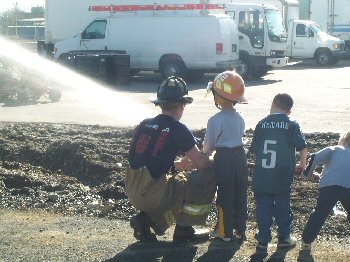 Children shooting the fire hose