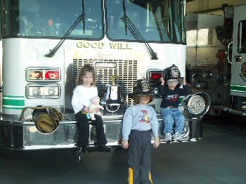 Children sitting on the bumper of Engine 52-2